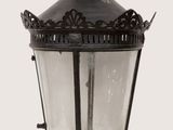 an old fashioned lamp with a crown on top of it