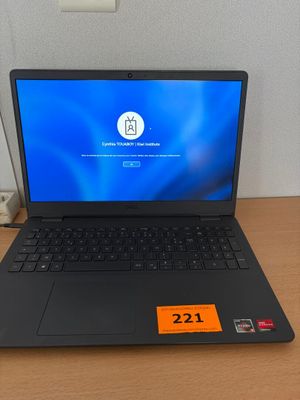 an open laptop computer sitting on top of a wooden desk