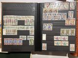 a black book with stamps on it and a picture of people on it