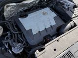 a car with its hood open and the engine in the trunk