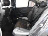 the back seats of a car are black and grey in color