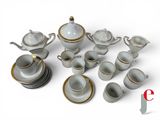 an image of a group of white and gold coffee cups and saucers