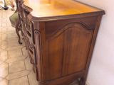 a wooden table with a mirror on top of it