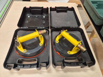 two yellow jacks sitting in a case on a table