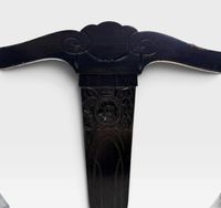 Fauteuil de type curule en bois noirci mouluré et sculpté à … (photo 3)