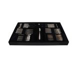 a black tray with a set of silverware in it