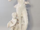 a statue of a woman with a child on her lap