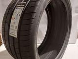 a close up of a tire on a table with a white background