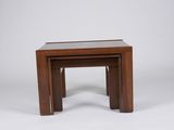a set of three nesting tables with a glass top on a white background