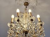 a crystal chandelier hanging from the ceiling in a room
