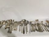 a lot of spoons and spoon spoons on the table