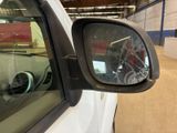 a reflection of a bike in the side view mirror of a car