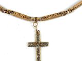 an image of a necklace with a cross on it on a white background