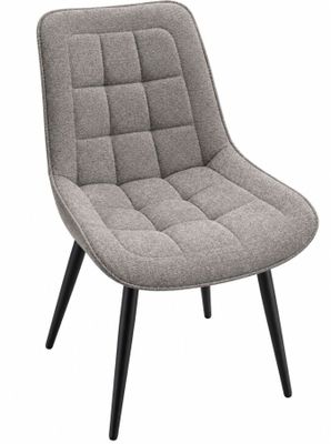 une chaise grise avec des pieds noirs et un coussin dessus