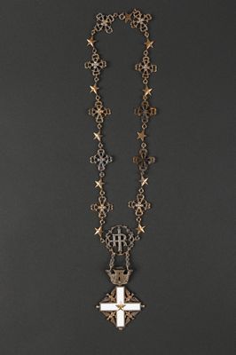 necklace with a cross and a cross pendant on a chain