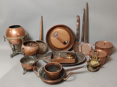 many different types of copperware on the table