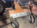 a small machine that is sitting in the garage
