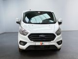 the front of a white ford transit van parked in a white room