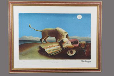 framed print of a painting of a lion on a blanket