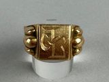 an image of a gold ring with the letter c on it