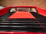 an image of a red car parked in a garage