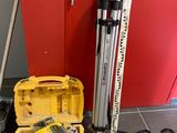 a yellow tool box with tools in it on the floor