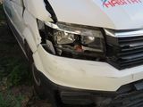 a van that has been damaged and is parked on the side of the road