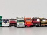 a lot of toy cars that are lined up in a row
