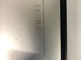 a close up of the back of a silver laptop computer