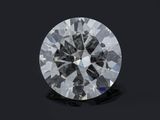 a round brilliant cut diamond on a black background