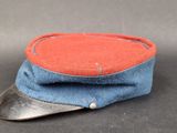 a red and blue hat on a black surface