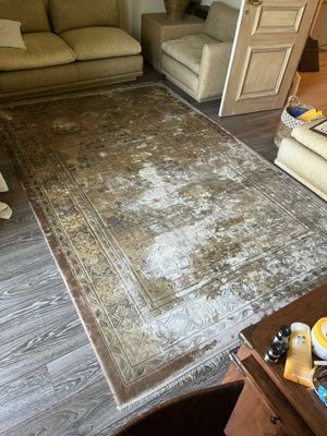 an image of a living room with a rug on the floor