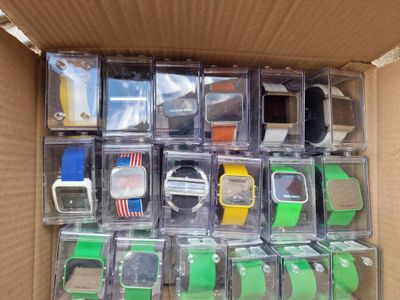 a box full of assorted watches and other items