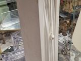 an image of a tall white cabinet with a door open