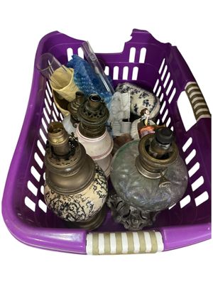 a purple basket filled with bottles and other items