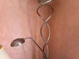 a lamp that is sitting on a table next to a lamp