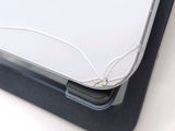 a close up of a laptop with wires on it