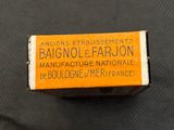 an orange and white box of soap sitting on top of a black surface
