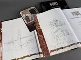 a book opened to show a drawing of a man riding a horse