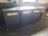 an image of a kitchen with a counter and a window