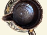 a close up view of a coffee cup on a table