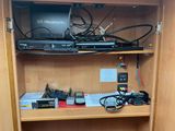 a cabinet with a bunch of electronics on top of it