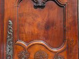 a wooden door with a decorative design on it
