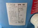 a blue water tank with a red and white label on it