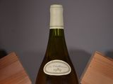 a bottle of wine that is sitting on a table