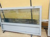 two glass display cases sitting next to each other in a room