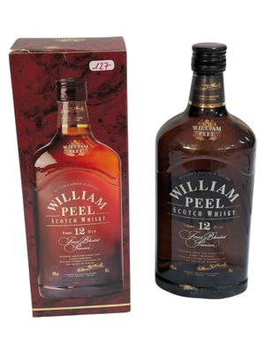 an image of a bottle of whisky sitting next to a box