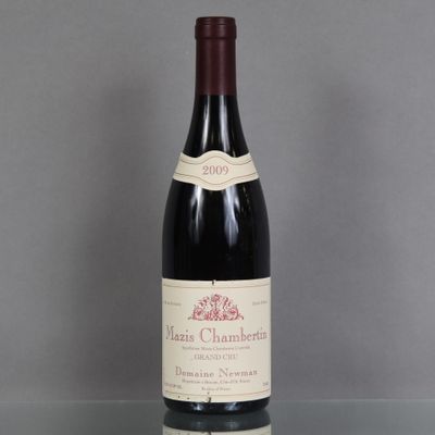 a bottle of wine that is sitting on a table