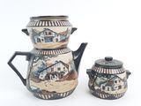 a tea pot and a tea pot sitting next to each other