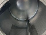 a close up of a washer with the door open